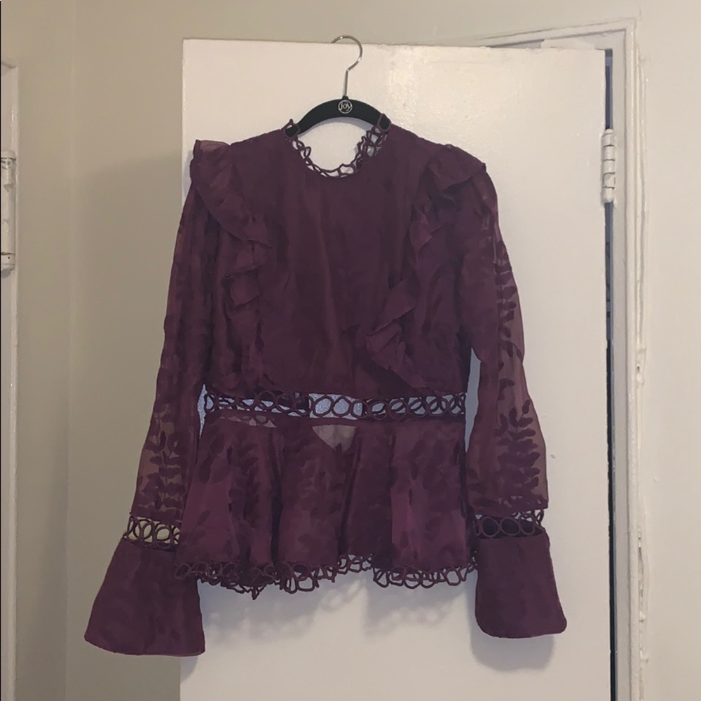 A lace bell-sleeved blouse